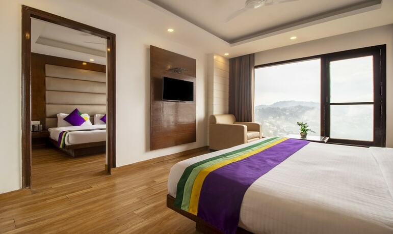 Imagen de la habitación del Hotel Treebo Tryst Queen Of Hills. Foto 16