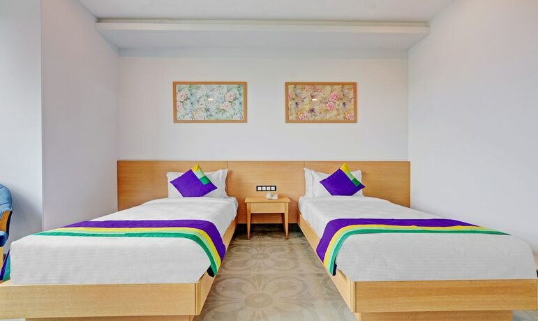 Imagen de la habitación del Hotel Treebo Tryst SR House. Foto 18