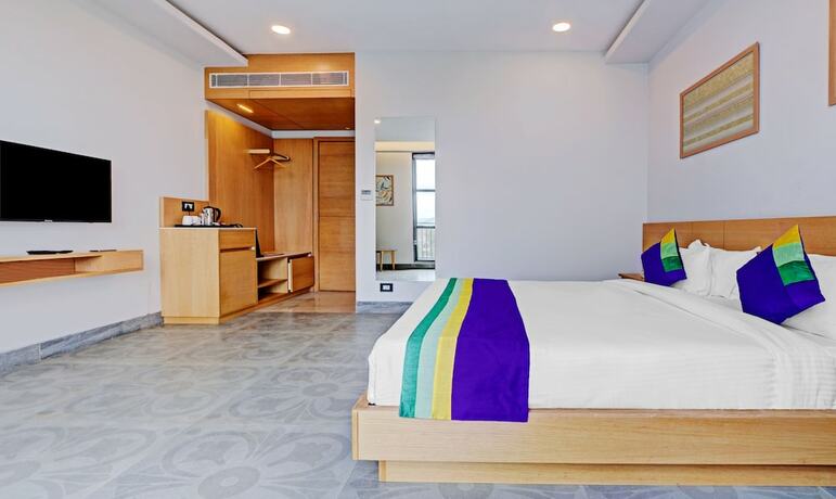 Imagen de la habitación del Hotel Treebo Tryst SR House. Foto 19