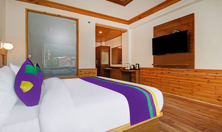 Imagen de la habitación del Hotel Treebo Tryst Sattva With Mountain View. Foto 2