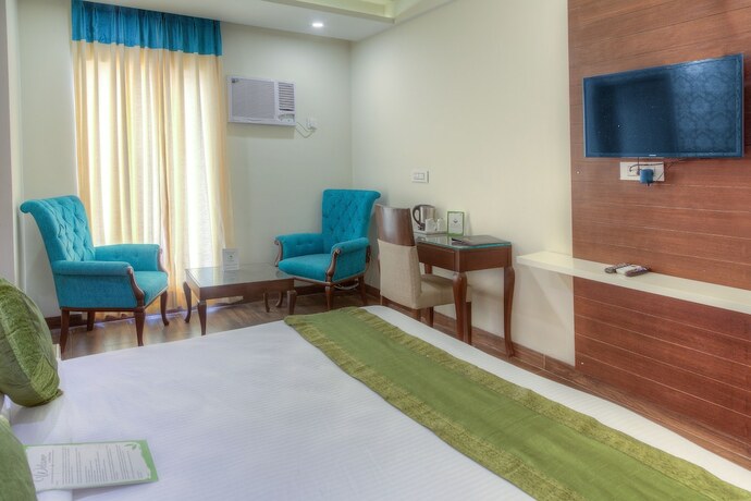 Imagen de la habitación del Hotel Treebo Tryst Sc Residency. Foto 11