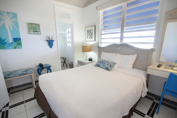 Imagen de la habitación del Hotel Tres Palmas Inn. Foto 11