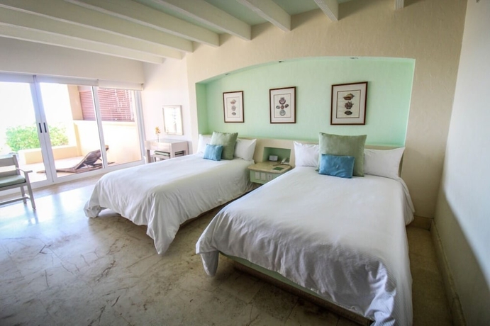 Imagen de la habitación del Hotel Tres Vidas Acapulco Suites. Foto 9
