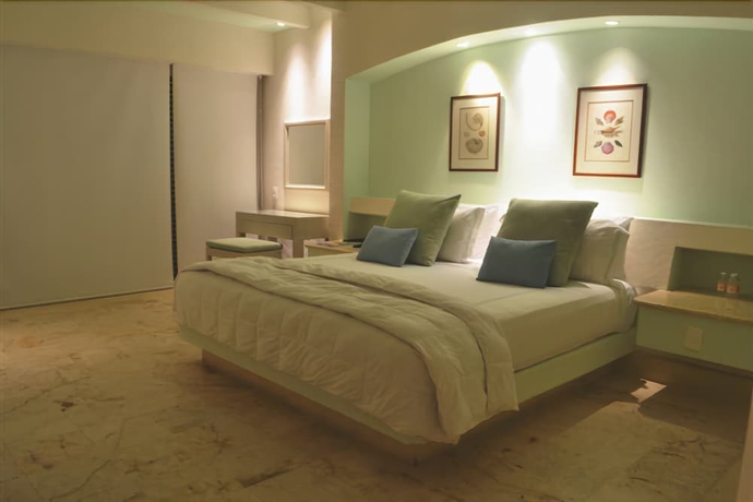 Imagen de la habitación del Hotel Tres Vidas Acapulco Suites. Foto 11