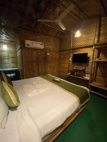 Imagen de la habitación del Hotel Tridhara Homestay. Foto 14
