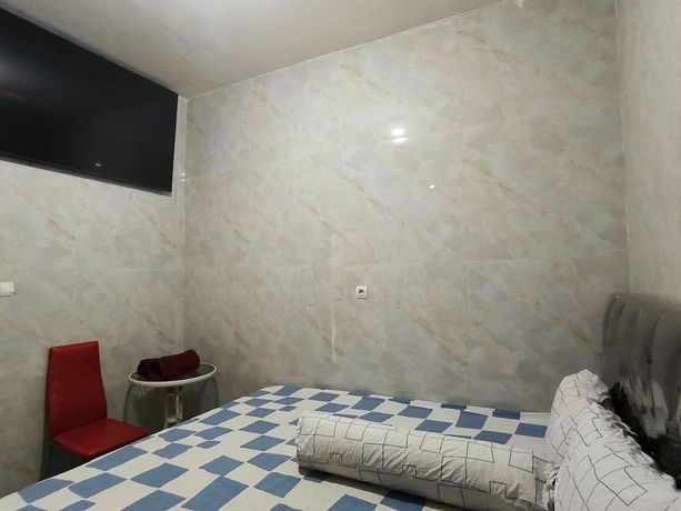Imagen de la habitación del Hotel Trikora Guesthouse Syariah 2. Foto 11
