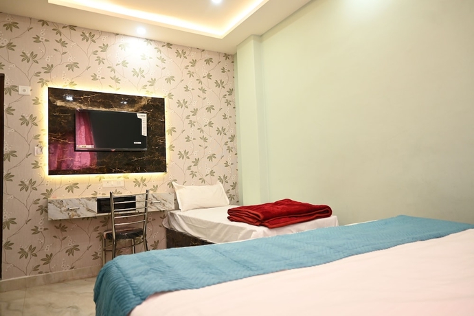 Imagen de la habitación del Hotel Trinetra Homestay. Foto 4