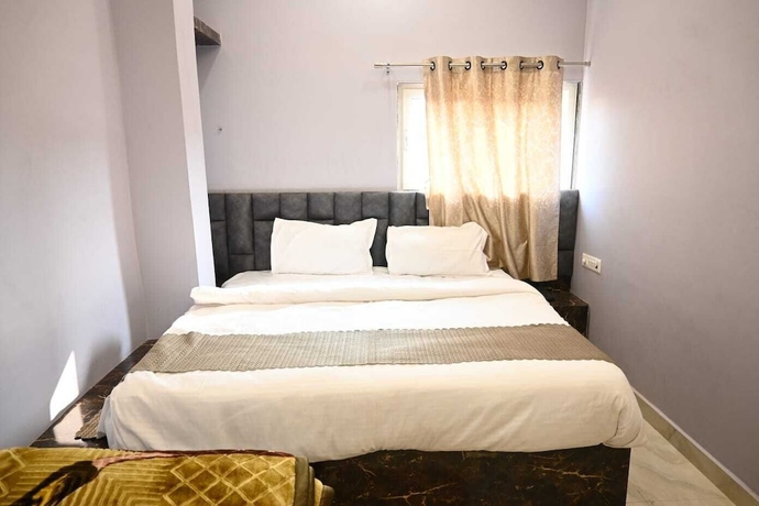 Imagen de la habitación del Hotel Trinetra Homestay. Foto 9