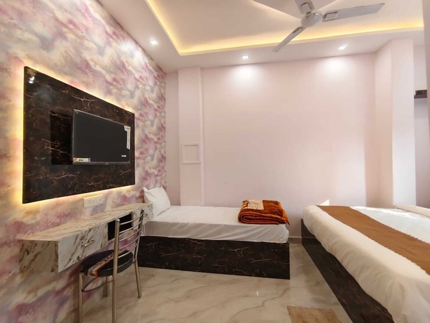 Imagen de la habitación del Hotel Trinetra Homestay. Foto 10