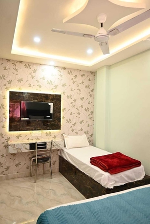 Imagen de la habitación del Hotel Trinetra Homestay. Foto 11