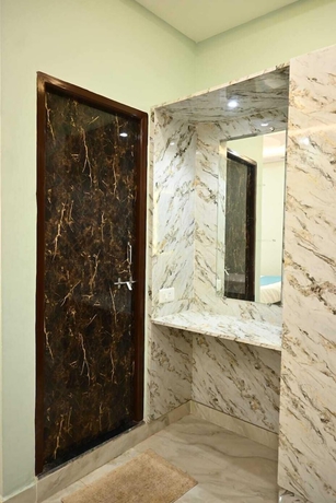 Imagen de la habitación del Hotel Trinetra Homestay. Foto 12