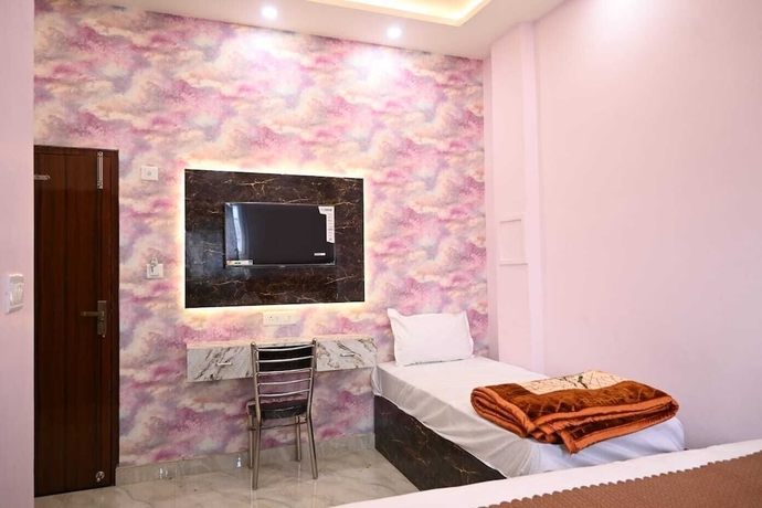 Imagen de la habitación del Hotel Trinetra Homestay. Foto 13