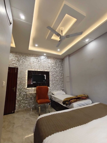 Imagen de la habitación del Hotel Trinetra Homestay. Foto 15