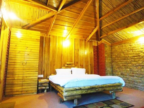 Imagen de la habitación del Hotel Trinetra Orchards. Foto 19