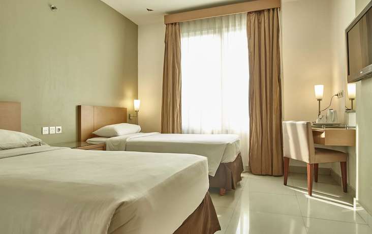 Imagen de la habitación del Hotel Triniti Jakarta. Foto 11