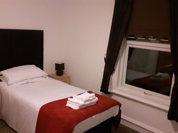 Imagen de la habitación del Hotel Trinity Guest House. Foto 5