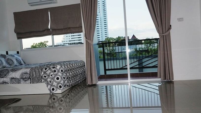 Imagen de la habitación del Hotel Trio Gems Condo Beach. Foto 20