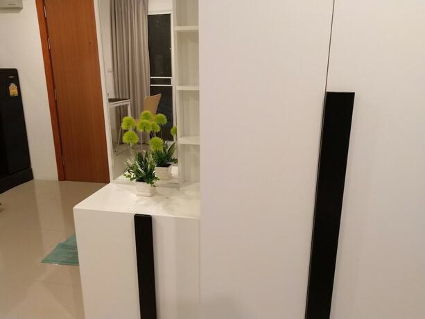 Imagen de la habitación del Hotel Trio Gems Condo Beach. Foto 21