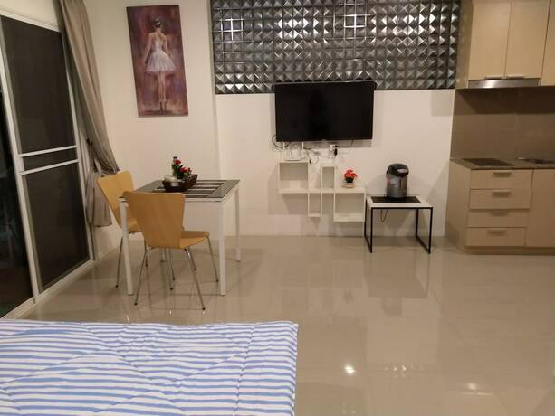 Imagen de la habitación del Hotel Trio Gems Condo Beach. Foto 25