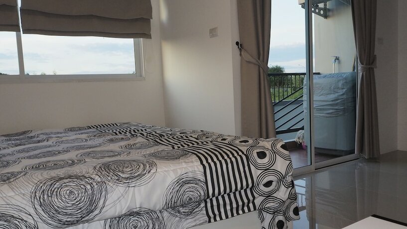 Imagen de la habitación del Hotel Trio Gems Condo Beach. Foto 26