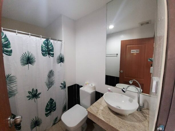 Imagen de la habitación del Hotel Trio Gems Condo Beach. Foto 37