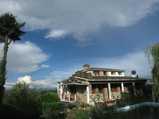 Imagen general del Hotel Trishul Orchard Resort. Foto 6