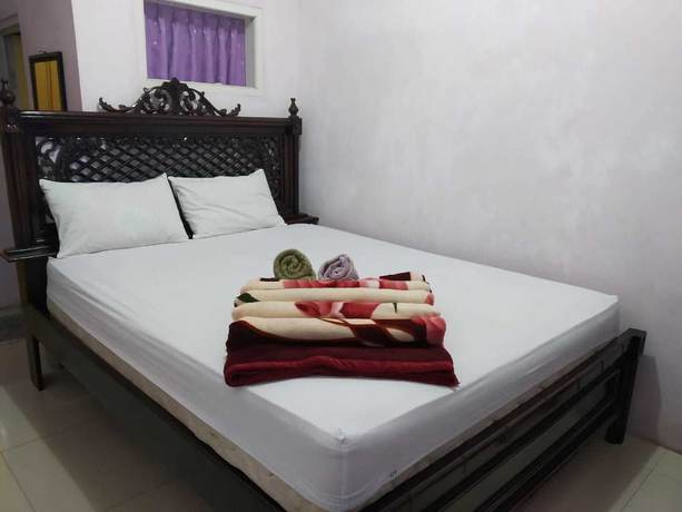 Imagen de la habitación del Hotel Trivadoh Syariah. Foto 8