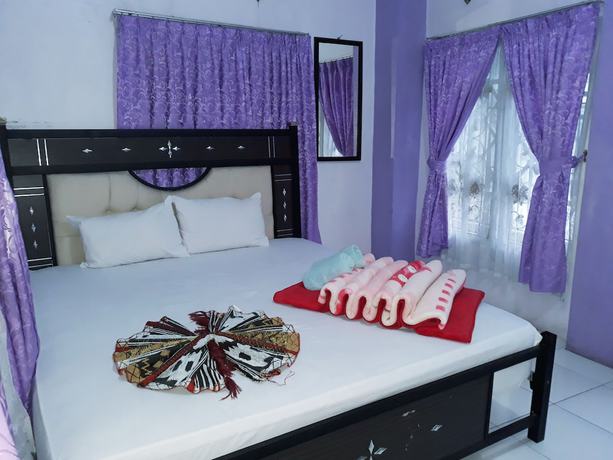 Imagen de la habitación del Hotel Trivadoh Syariah. Foto 11