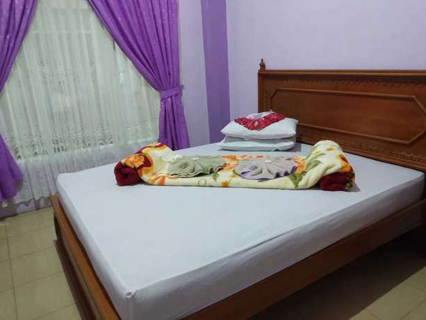 Imagen de la habitación del Hotel Trivadoh Syariah. Foto 15