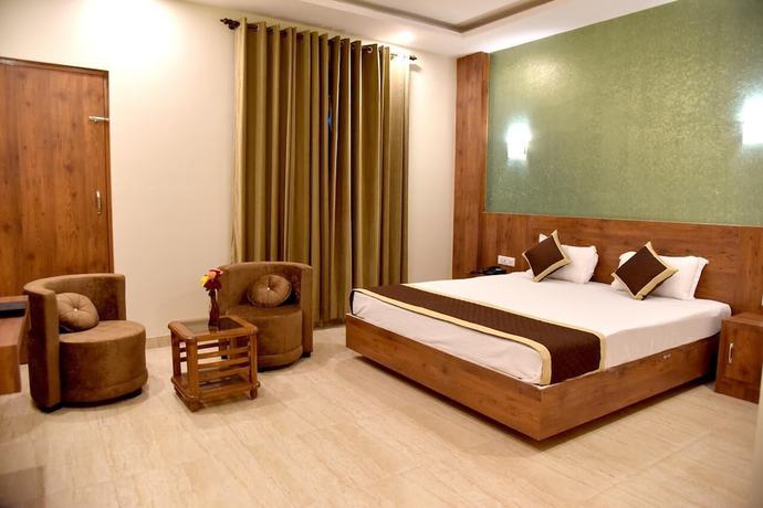 Imagen de la habitación del Hotel Triveni Residency. Foto 14