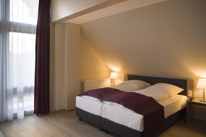 Imagen de la habitación del Hotel Troll's Brauhaus. Foto 7