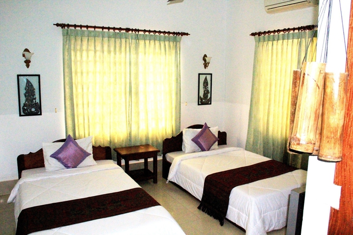 Imagen de la habitación del Hotel Tropical Breeze Guesthouse. Foto 2