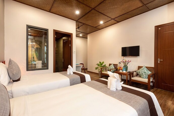 Imagen de la habitación del Hotel Tropical Home Villa. Foto 13