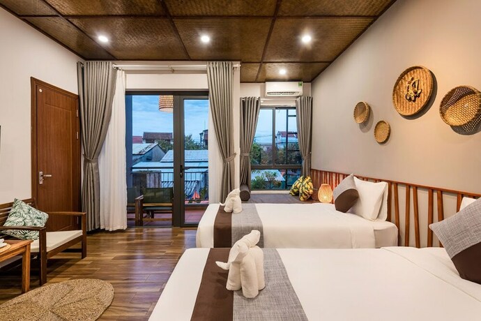 Imagen de la habitación del Hotel Tropical Home Villa. Foto 33