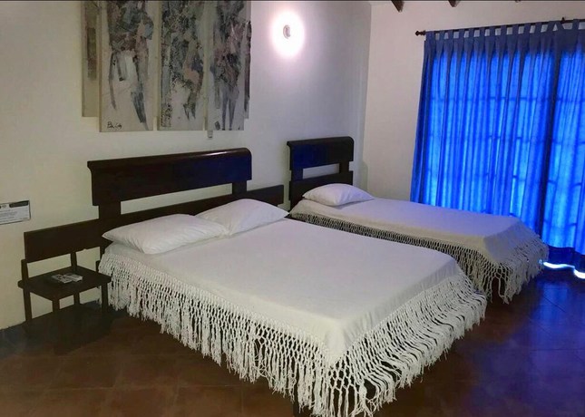 Imagen de la habitación del Hotel Tropical Inn. Foto 6