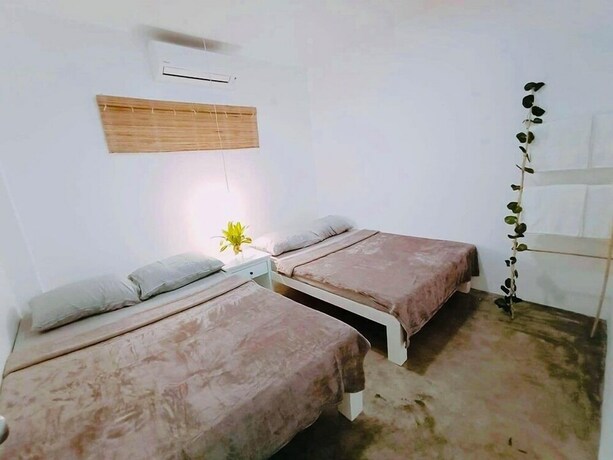Imagen de la habitación del Hotel Tropical Vibes Inn Siargao. Foto 20