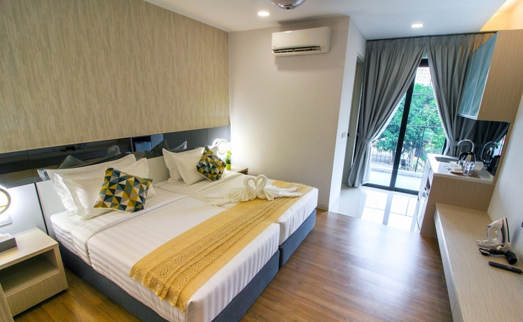 Imagen de la habitación del Hotel Tropical Villa Service Suite. Foto 5