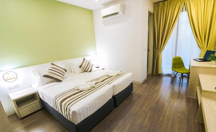 Imagen de la habitación del Hotel Tropical Villa Service Suite. Foto 7