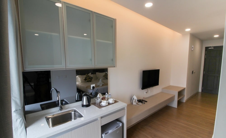 Imagen de la habitación del Hotel Tropical Villa Service Suite. Foto 13