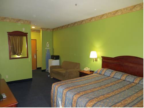 Imagen de la habitación del Hotel Tropicana Inn And Suites, Dallas. Foto 9