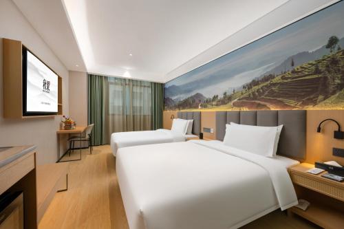 Imagen de la habitación del Hotel True Go - Shenzhen Futian Huaqiang North. Foto 19