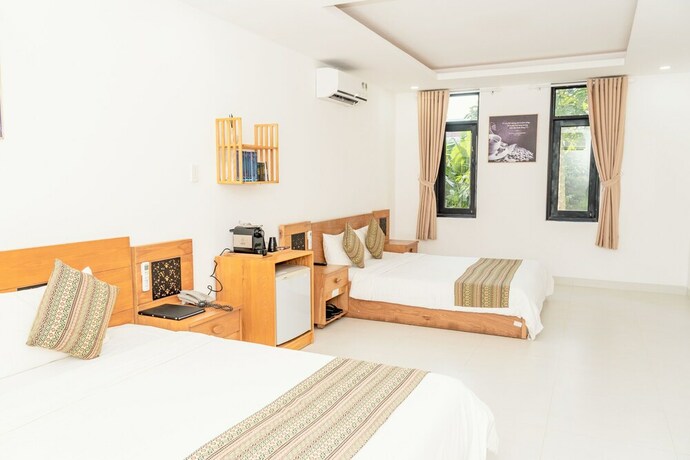 Imagen de la habitación del Hotel Trung Nguyen Coffee Resort. Foto 32