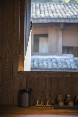 Imagen de la habitación del Hotel Tsingpu Fujian Tulou Retreat. Foto 11
