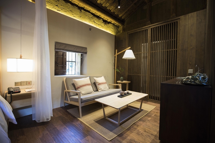 Imagen de la habitación del Hotel Tsingpu Fujian Tulou Retreat. Foto 12