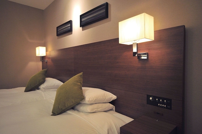 Imagen de la habitación del Hotel Tsu Center Palace. Foto 11