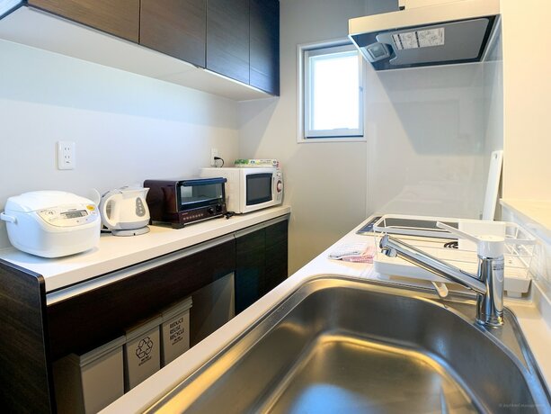 Imagen de la habitación del Hotel Tsukasa Condo Chatan Araha. Foto 23