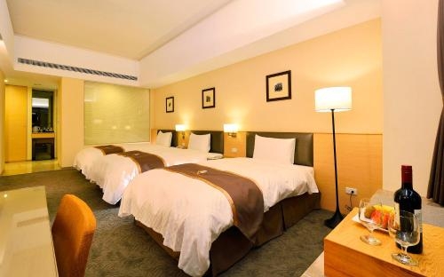 Imagen de la habitación del Hotel Tsun Huang. Foto 7