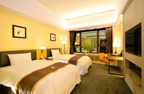 Imagen de la habitación del Hotel Tsun Huang. Foto 10