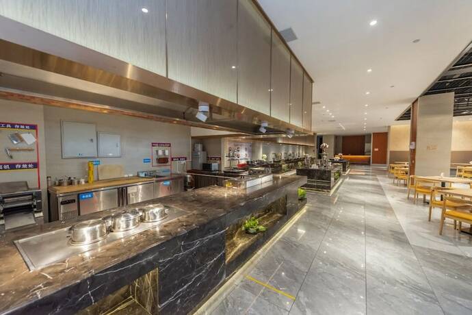 Imagen del bar/restaurante del Hotel Tuanfenghong Road International. Foto 6