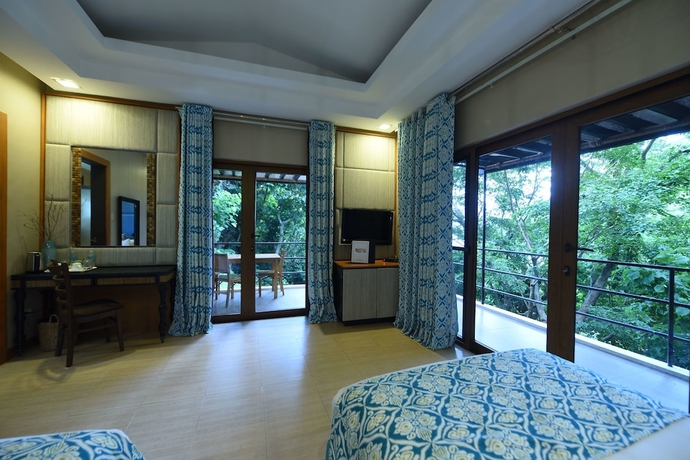 Imagen de la habitación del Hotel Tugawe Cove Resort. Foto 2